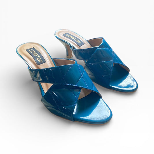 Blue high-heeled shoes on a white background